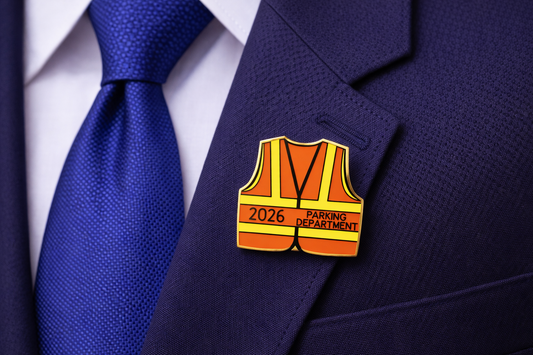 Pin on a suit lapel resembling a parking department safety vest with '2026' and 'Parking Department' text.