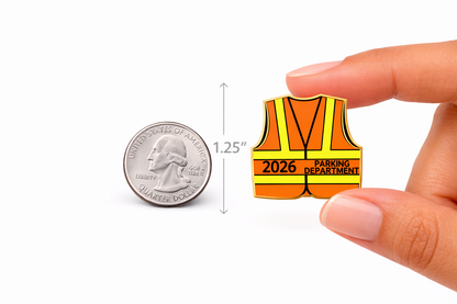 Pin with a safety vest design labeled '2026 Parking Department' next to a quarter for scale on a white background.