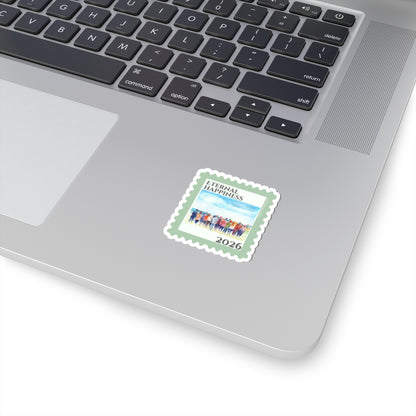 Laptop with a sticker featuring a design of people and the text 'Eternal Happiness 2026'
